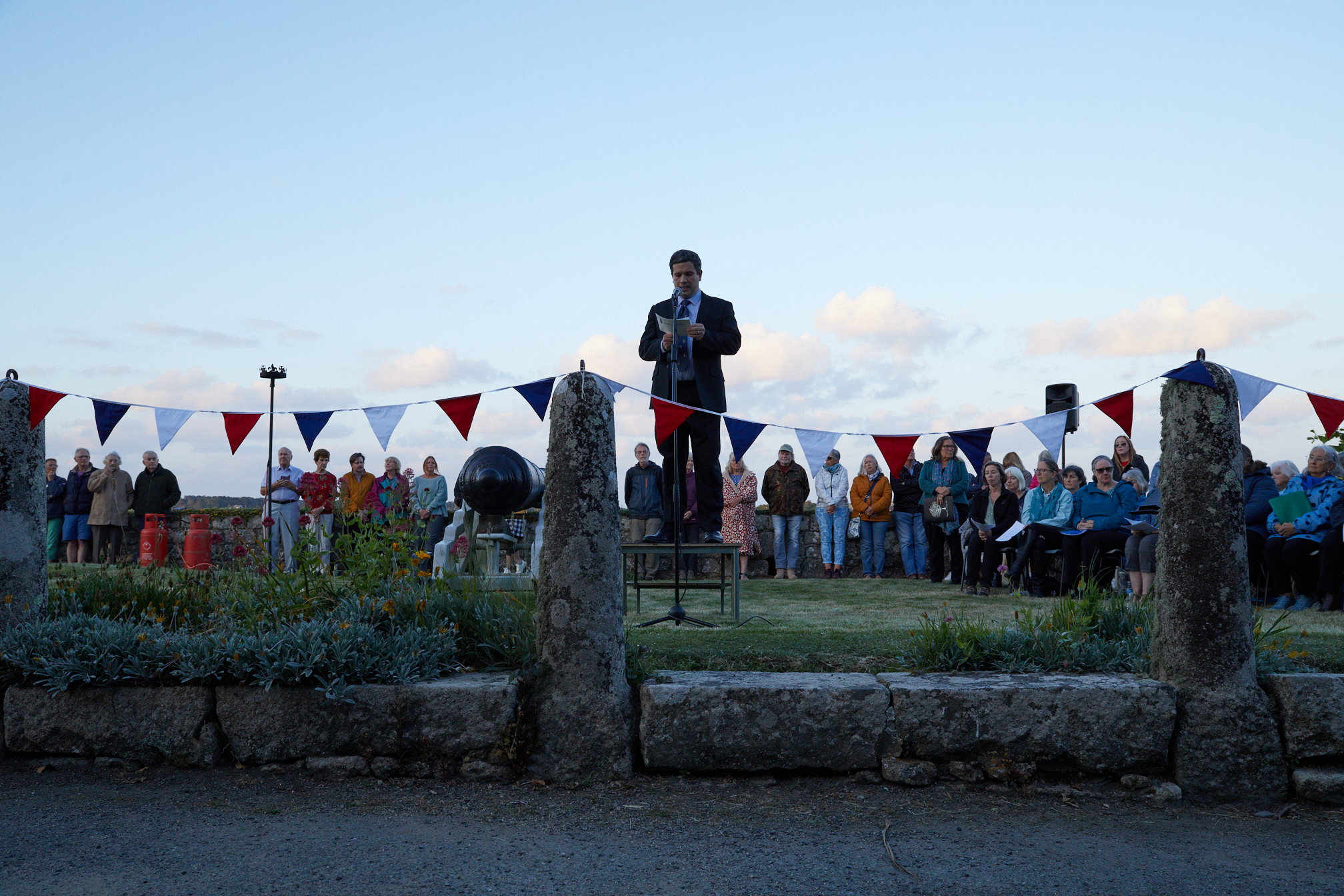 Photo of Nathan Dean from the Duchy of Cornwall making a speech at the D-Day 80 Anniversary commemoration ceremony